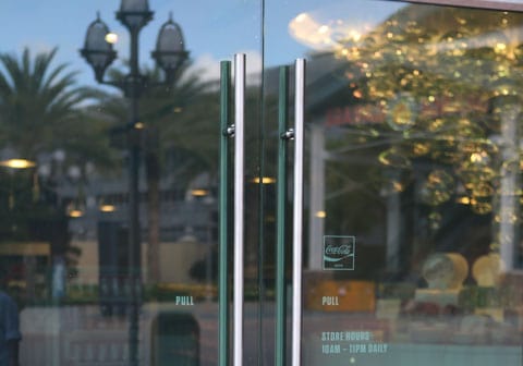 Glass entry doors with long round pull handles