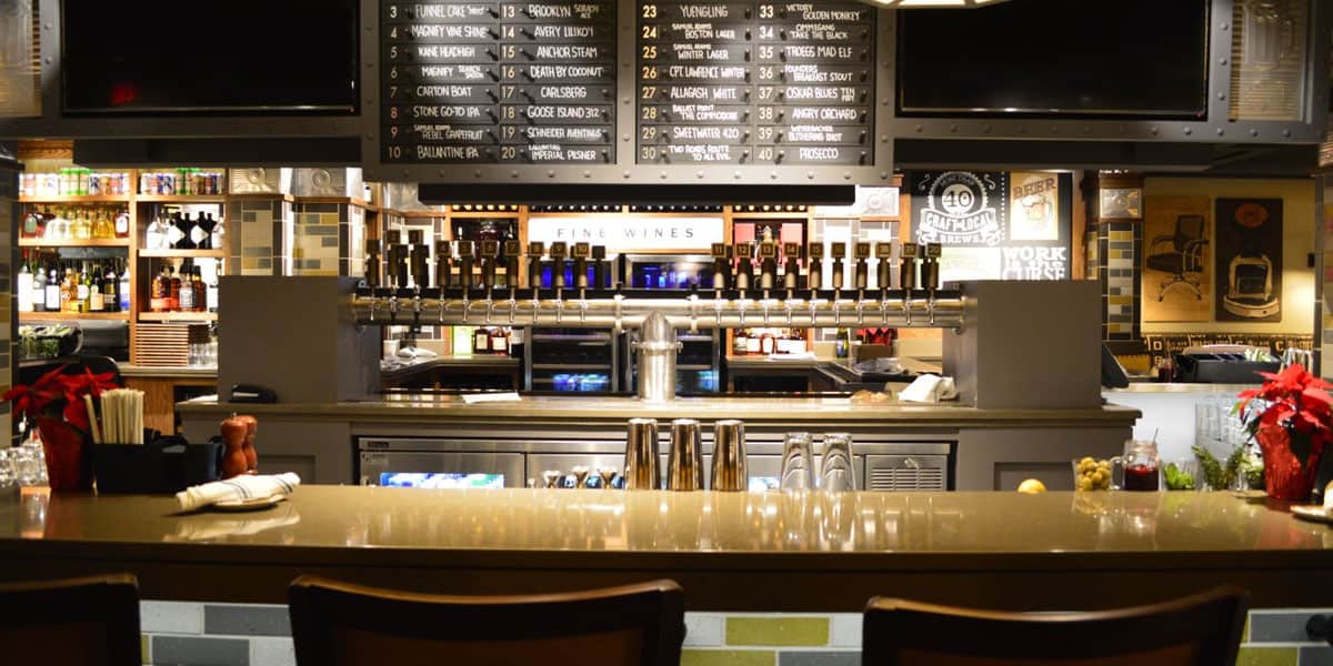 Office Tavern bar featuring custom tap handles below craft beer menu