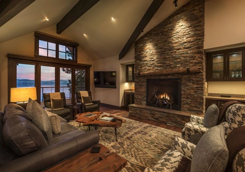 Cozy living room with fireplace and lake view