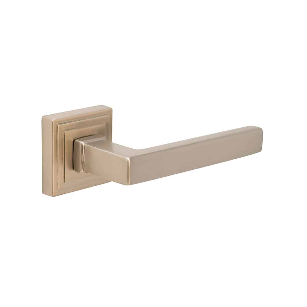 Modern gold-tone door handle with a , rectangular design